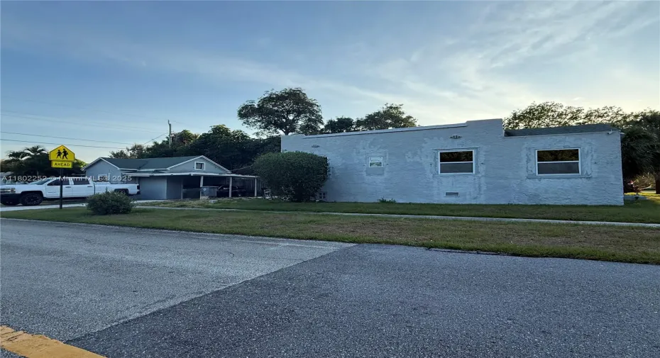 This is a picture of the full property including the main house and the guest house you can also view the carport