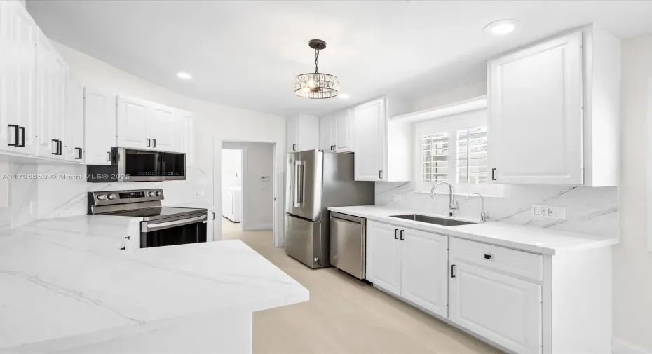 Renovated with sleek quartz counter tops and brand new LG appliances.