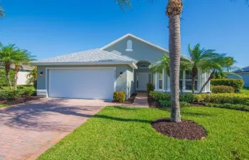 Freshly painted Concrete Block home with a new roof and impact glass