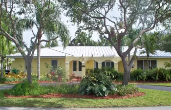 North Pinecrest Rental home with a NEWER METAL ROOF, ALL IMPACT Windows & Doors, a 25KW Auto/Generator to power 50% of the house in the event of power failures! Beautifully updated with a newer kitchen with a new refrigerator and dishwasher, all appliances are Stainless Steel! Just off the kitchen is the Family Breakfast area with French Doors opening out to the Pool-patio! Very nice travertine floors in all the social areas! Notice the circular driveway for extra parking with 2 beautiful Oak trees!