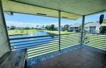 Screened in balcony with nice views of the cascading fountain in the pond.
