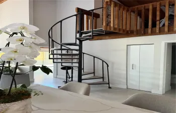 stairs to loft and third bedroom/1/2 bath