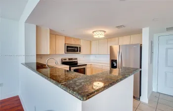 KITCHEN WITH BRAND NEW STAINLESS STEEL APPLIANCES