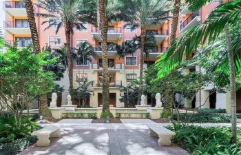 Corner unit faces Courtyard, also South, East and North views; enjoy the soothing sounds of water and beautiful palm trees from your balcony