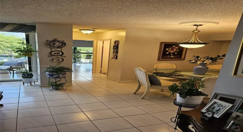 Partial view of the balcony and 2nd bedroom from the front entrance area of condo.