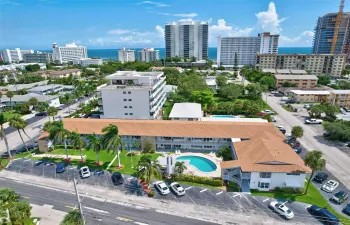 Your 1st Floor Unit Features an Updated and Open Kitchen with Stainless Steel Appliances, Granite Countertops and a Snack Bar with Extra Cabinet Storage. This in one of the few Open Kitchens in the building which lends itself to Great Entertaining. Your Kitchen has POOLSIDE VIEWS!