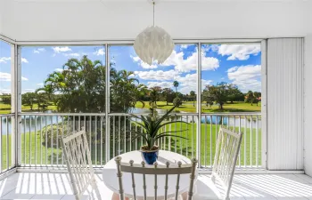 1 of 2 Screened Balconies with accordion Shutters