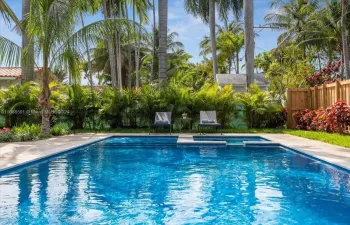 Heated pool with spa, featuring mobile-enabled automated controls.