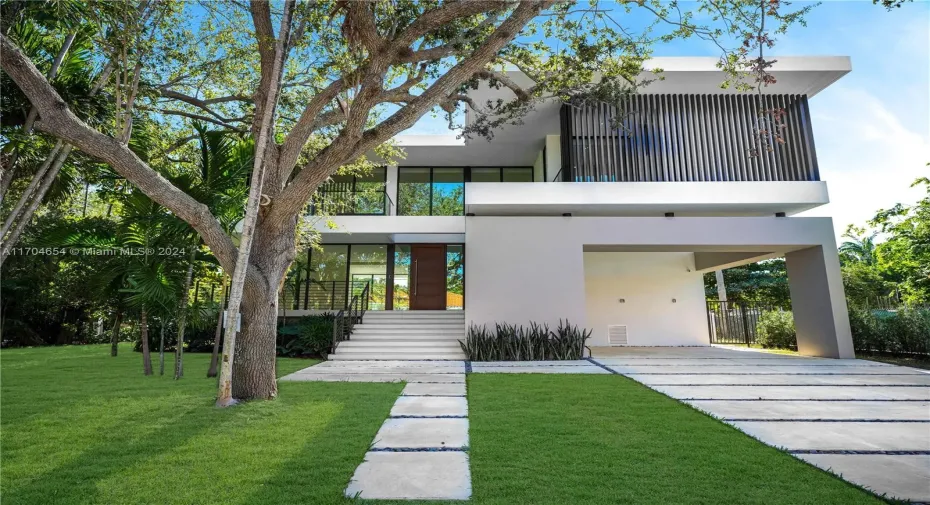 Modern Architecture surrounded by mature landscaping.