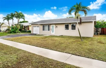 FRONT OF HOME W/STAGED LANDSCAPE
