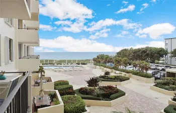 View from balcony over courtyard and pool to the ocean!