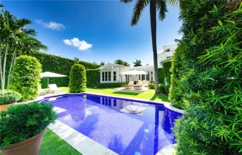 Expansive manicured grounds with heated pool.