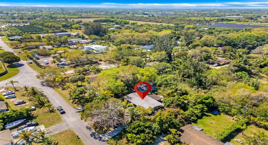  COUNTRY HOME 3/2 ON BUILDERS' HALF ACRE WITH 1/1 STUDIO IN DETACHED BUILDING....ASSORTED FRUI TREES, LUSH LANDSCAPING W MEANDERING PATHWAYS