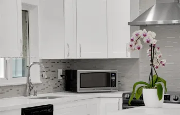 Stunning Open Concept & Modern Kitchen with Soft Close Shaker Cabinets & an Island to add that perfect touch of elegance!
