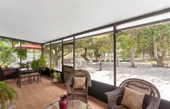 Step outside to your private lakefront oasis—featuring a screened patio, expansive brick paver patio, deck, fruit & shade trees, BBQ area & storage shed all designed for relaxing or entertaining.