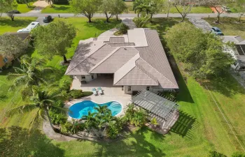 Poolside Paradise on a builders acre!