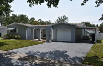 Oversized driveway with additional car port