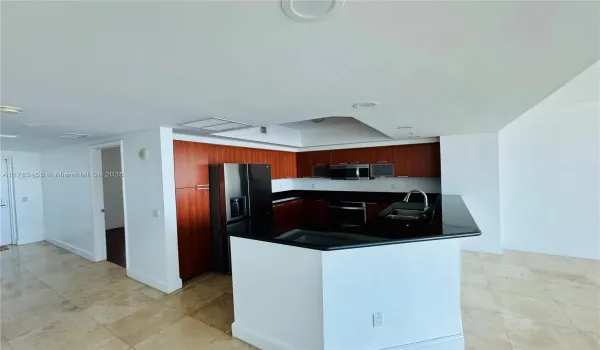Open kitchen with stainless steel appliances and extra cabinets space