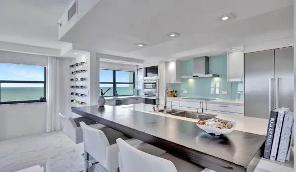 Kitchen with unique designer breakfast bar, wine wall, and coffee and wine bar