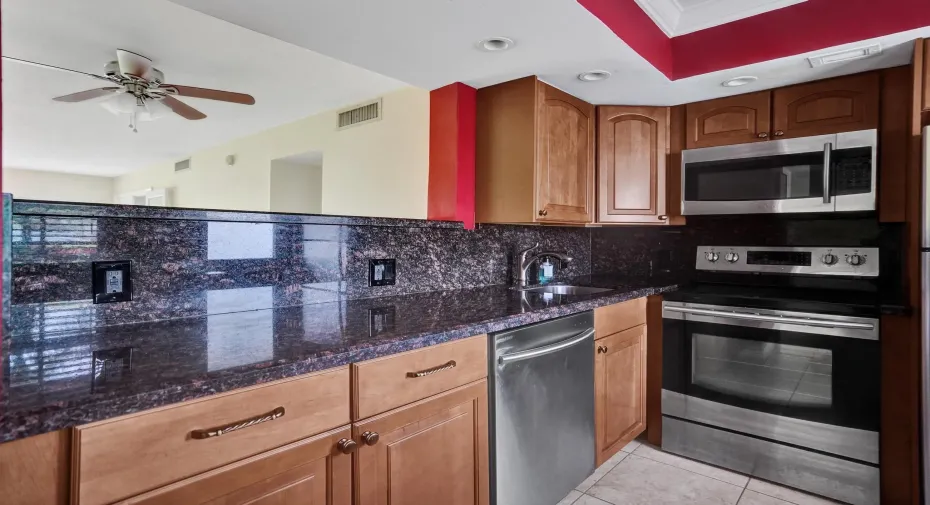 spacious kitchen open to living and dining area