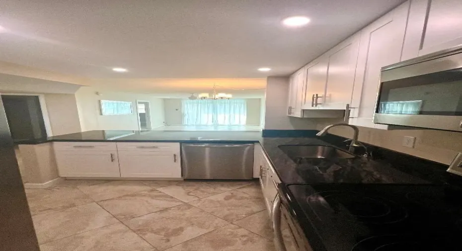 Magnificent all high end updated kitchen, granite, SS appliances, soft close white cabinets, etc.