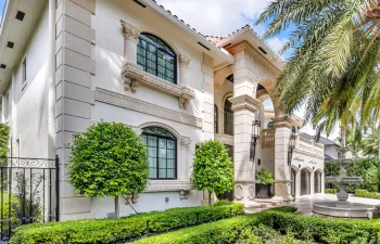 A lushly landscaped courtyard, bathed in automated lighting and centered around a dramatic 10-foot lion head fountain creates an unforgettable first impression, setting the tone for the effortless luxury that unfolds inside.
